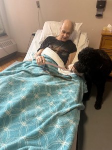 Leila visiting a resident of Copernicus Lodge.